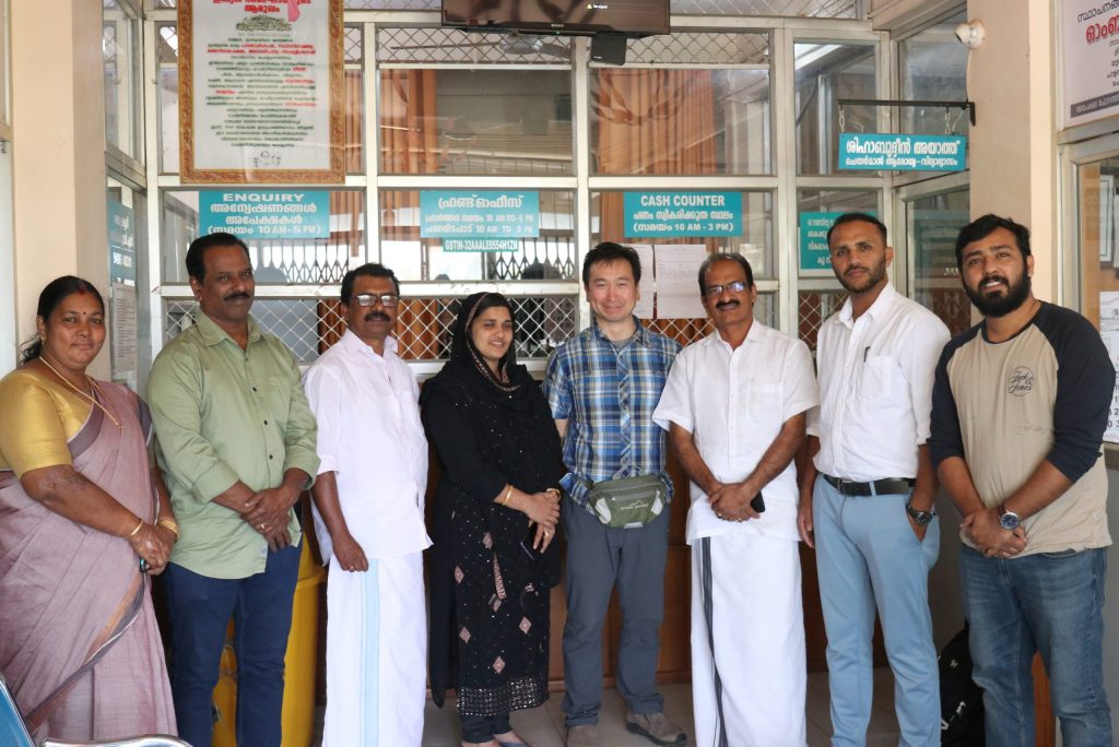Picture of Dr. Natori, Dr. Varghese, and representatives of a local government