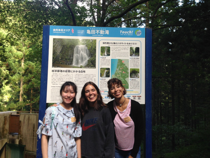 Akita International University exchange students visit waterfall after harvesting rice